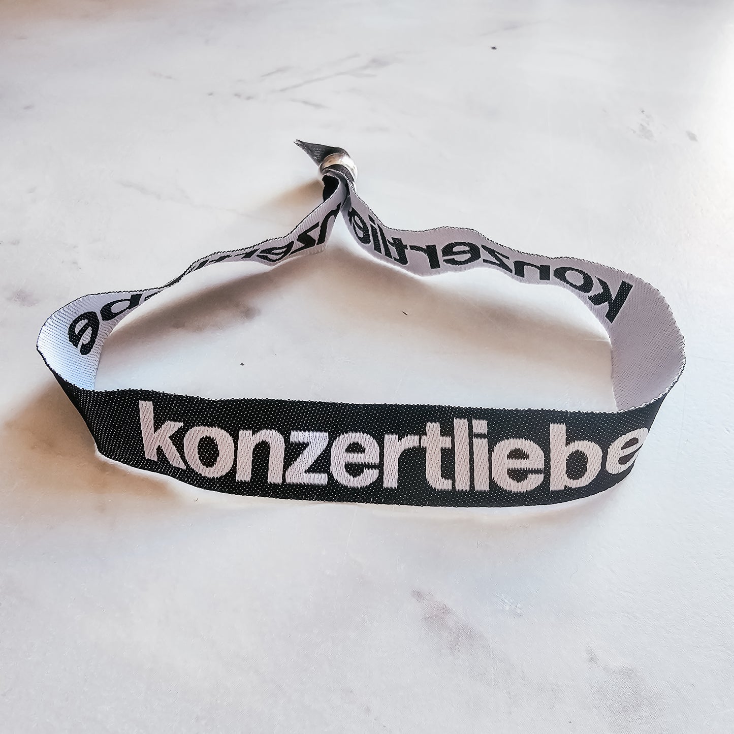 konzertliebe Bändchen| rosa | schwarz | gewebt | Festivalbändchen