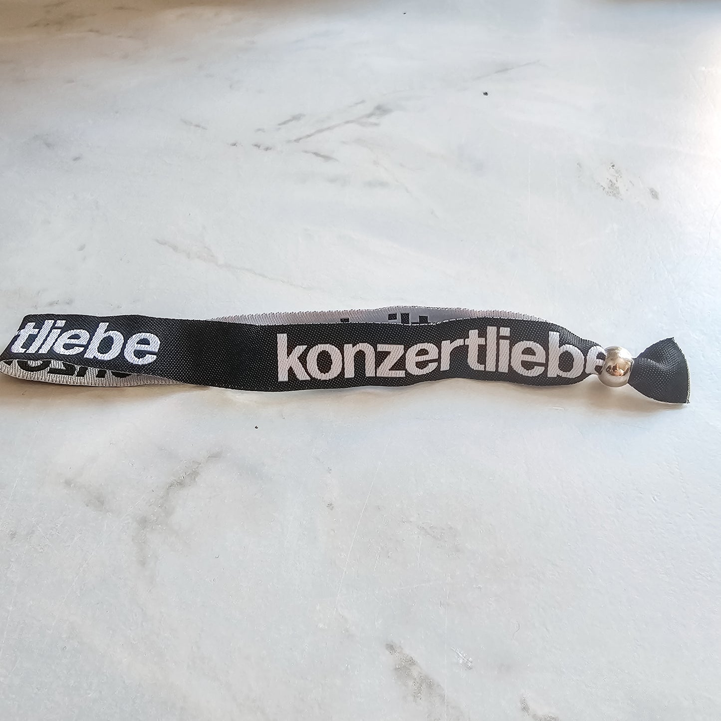 konzertliebe Bändchen| rosa | schwarz | gewebt | Festivalbändchen
